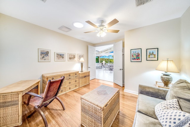 home office featuring ceiling fan and light hardwood / wood-style floors