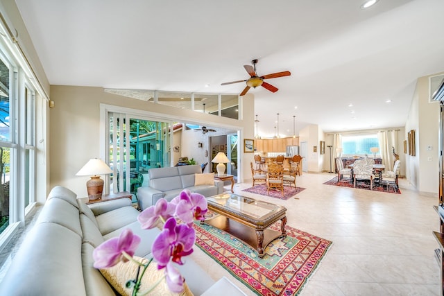 tiled living room with vaulted ceiling and ceiling fan