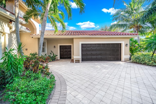 mediterranean / spanish house featuring a garage