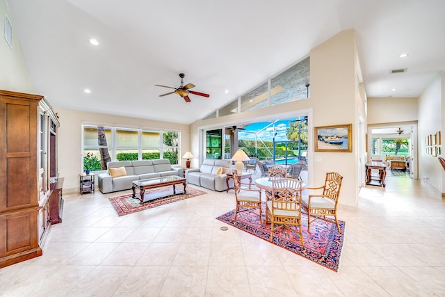 tiled living room featuring high vaulted ceiling and ceiling fan