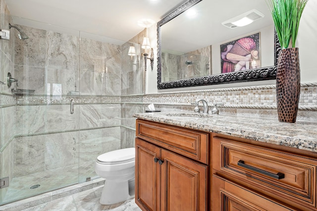 bathroom with decorative backsplash, vanity, tile walls, and a shower with shower door