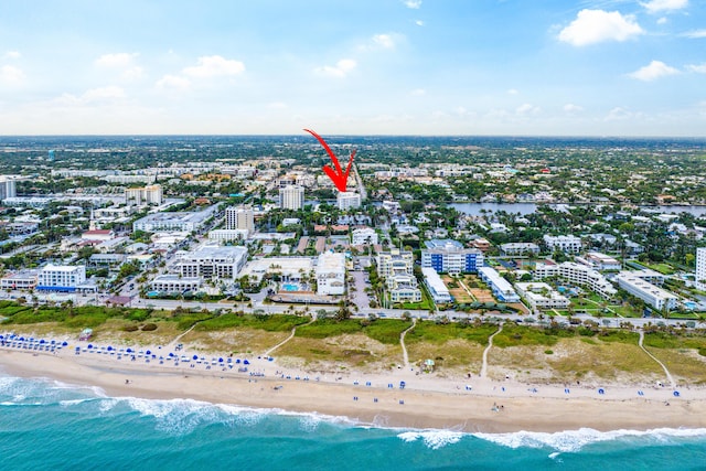 aerial view featuring a view of the beach and a water view