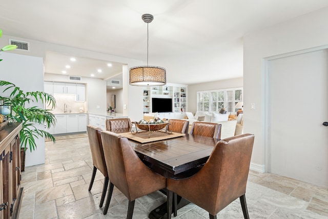 dining space featuring sink