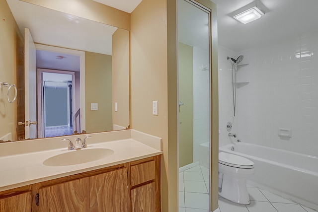 full bathroom with tile patterned floors, vanity, toilet, and tiled shower / bath combo