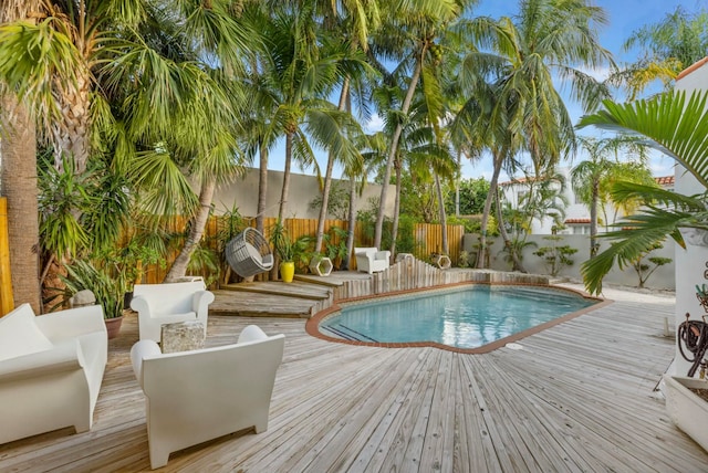 view of swimming pool featuring an outdoor hangout area and a wooden deck