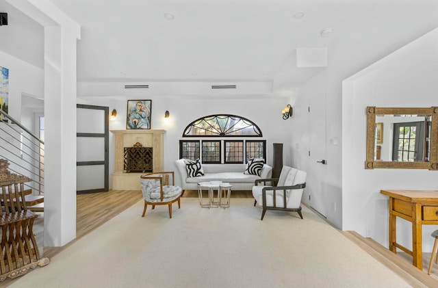 living area featuring plenty of natural light and light hardwood / wood-style floors