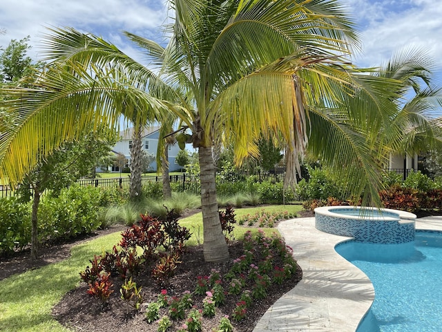 view of home's community featuring a jacuzzi