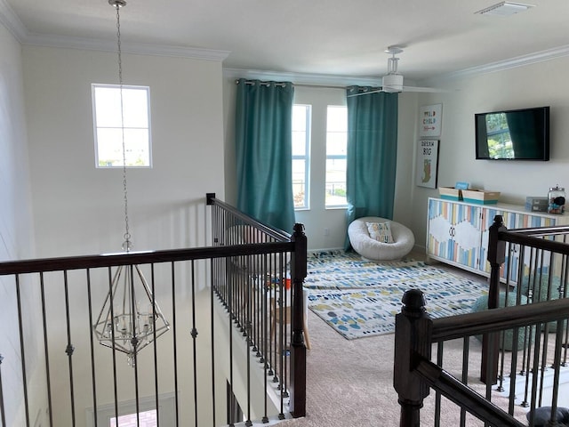 bedroom with carpet flooring, multiple windows, crown molding, and a chandelier