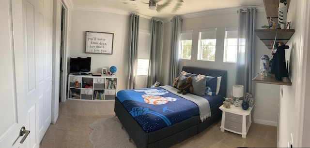 carpeted bedroom featuring ceiling fan