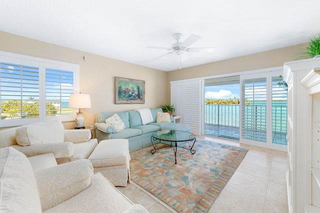 living room featuring ceiling fan and light tile patterned flooring