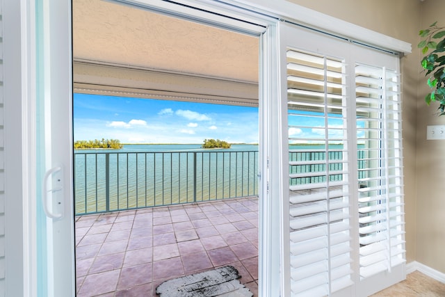 entryway with light tile patterned floors