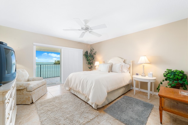 tiled bedroom with ceiling fan and access to exterior