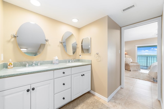 bathroom with tile patterned flooring and vanity