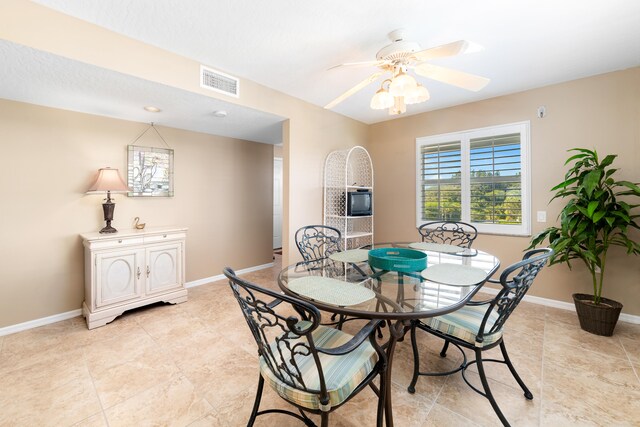 dining area featuring ceiling fan