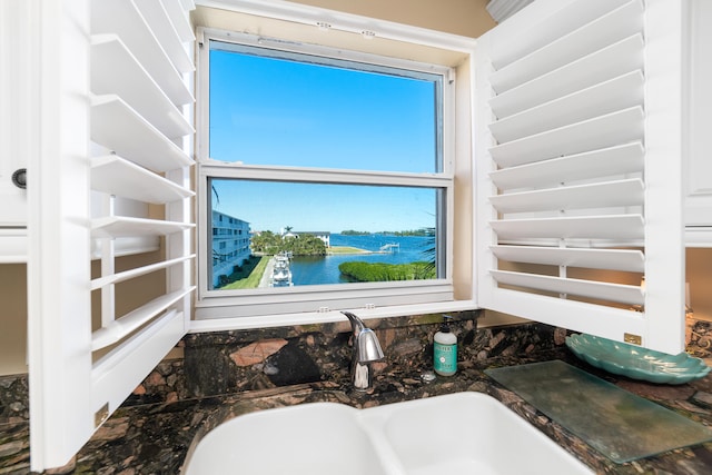 bathroom featuring vanity and a water view