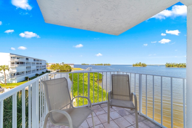 balcony featuring a water view