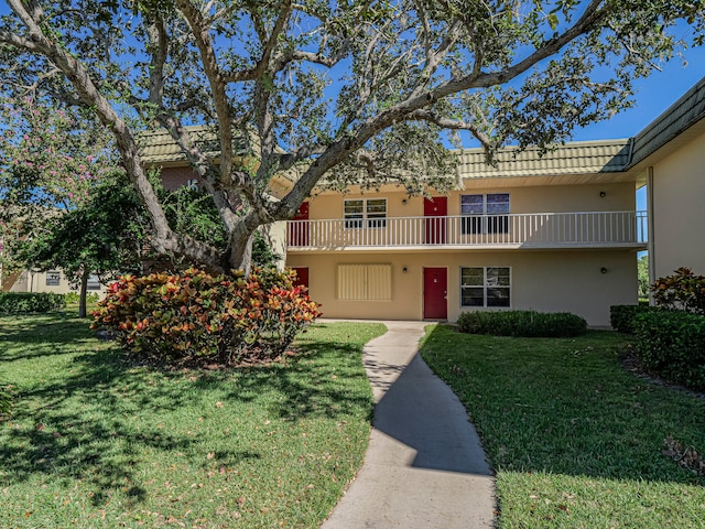 view of front of home with a front yard