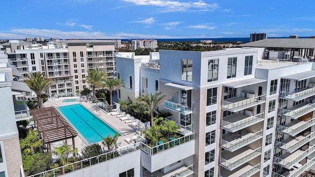 view of building exterior featuring a community pool