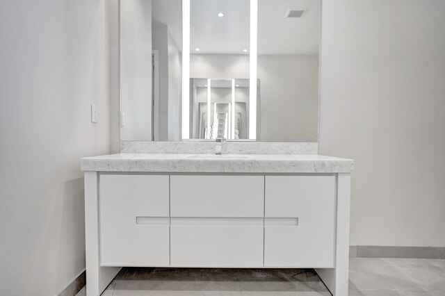 bathroom featuring toilet, a shower stall, and vanity