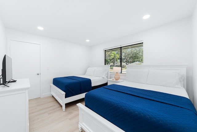 bedroom with light hardwood / wood-style flooring