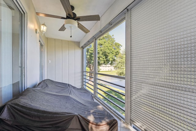 sunroom / solarium with ceiling fan