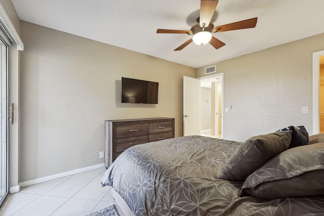 tiled bedroom with ceiling fan