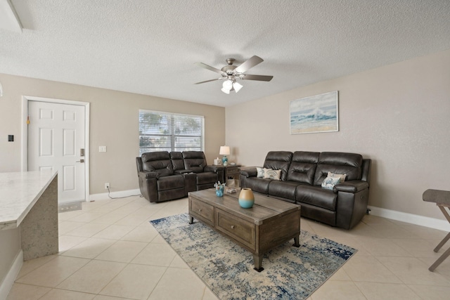 tiled living room with ceiling fan and a textured ceiling