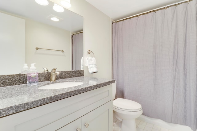 laundry area featuring stacked washer and dryer and light tile patterned flooring