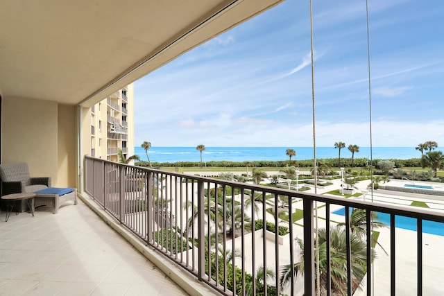 balcony featuring a water view