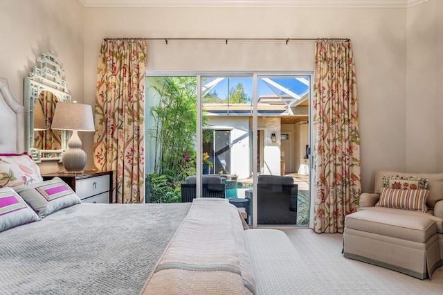 bedroom with access to outside, carpet flooring, and ornamental molding