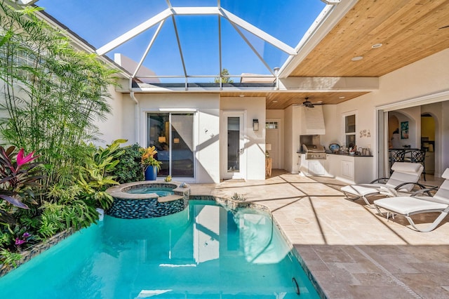 view of pool with an in ground hot tub, area for grilling, ceiling fan, a patio area, and a grill