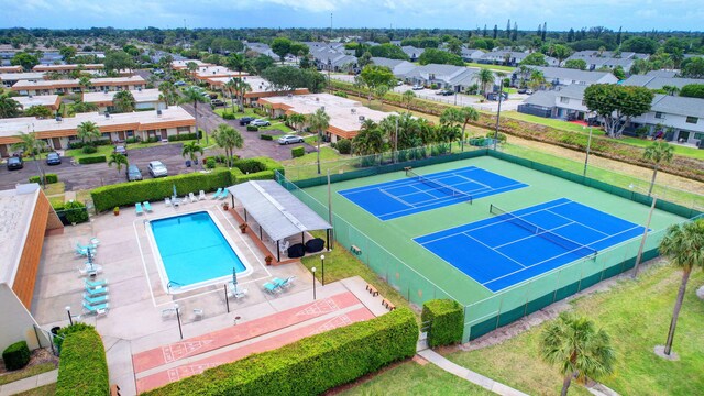 view of pool with tennis court