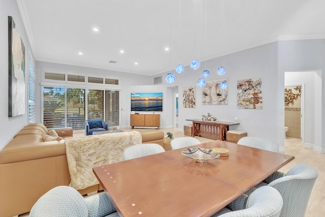 dining room featuring light hardwood / wood-style floors and ornamental molding