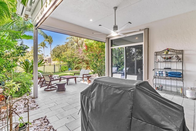 view of patio / terrace with grilling area, an outdoor living space, and ceiling fan