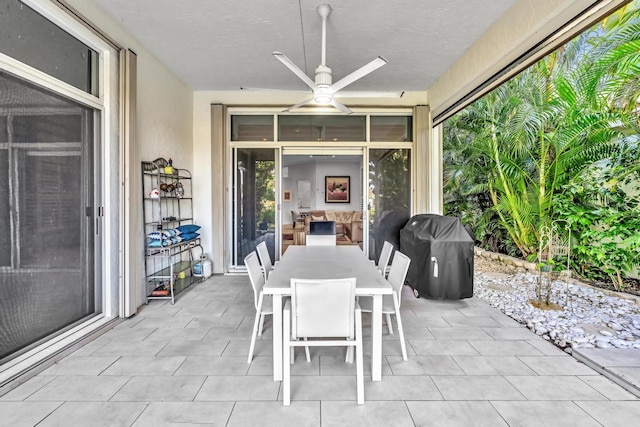 view of patio / terrace featuring ceiling fan and a grill