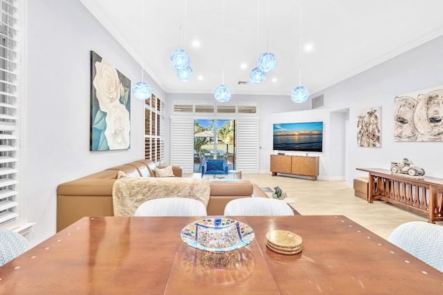 dining room featuring crown molding and light wood-type flooring