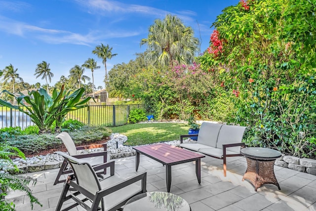 view of patio / terrace with an outdoor living space and a water view