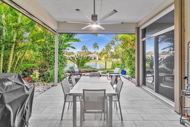 view of patio / terrace with ceiling fan and area for grilling