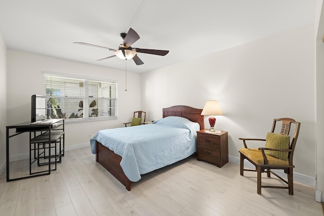 bedroom with ceiling fan and light hardwood / wood-style flooring