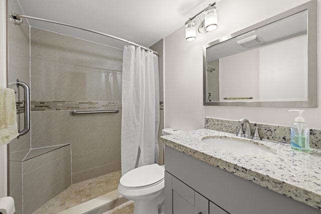 bathroom with vanity, toilet, and a shower with shower curtain