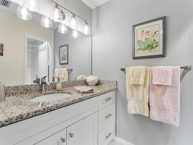 bathroom featuring vanity and a shower with shower curtain