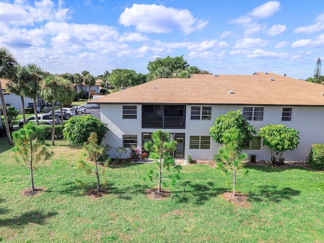 back of house with a yard