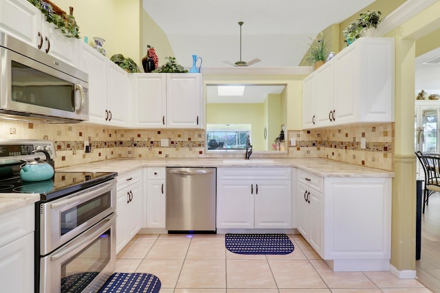 kitchen with white cabinetry and stainless steel appliances