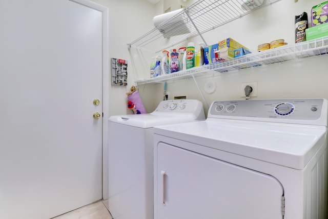 washroom with washing machine and dryer