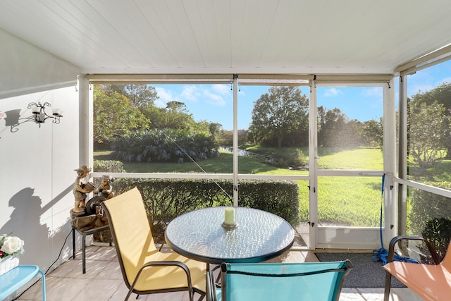 sunroom with a wealth of natural light and wooden ceiling