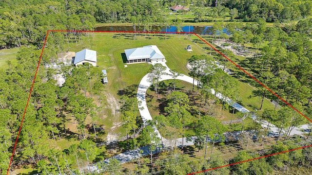 birds eye view of property featuring a water view