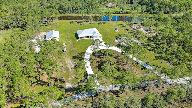 aerial view with a water view and a view of trees