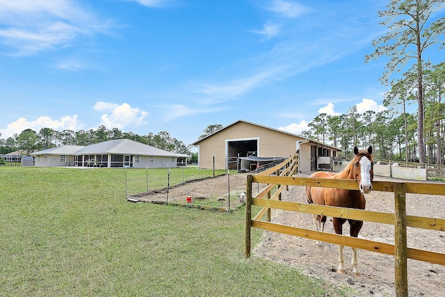 view of yard featuring an exterior structure and an outdoor structure