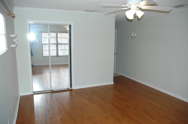 9890 Bischofia Tree Way Unit A, Boynton Beach, FL 33436 - unfurnished bedroom featuring multiple windows, wood finished floors, ornamental molding, a textured ceiling, and a ceiling fan