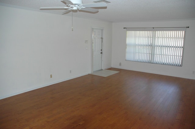 unfurnished room featuring hardwood / wood-style flooring, a textured ceiling, ceiling fan, and ornamental molding